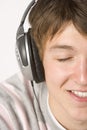 Teenage Boy Listening To Music On Headphones Royalty Free Stock Photo