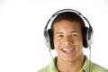 Teenage Boy Listening To Music On Headphones Royalty Free Stock Photo