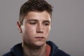 Teenage boy looking down, head and shoulders portrait Royalty Free Stock Photo