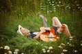 Teenage boy lying on grass with his acoustic guitar Royalty Free Stock Photo