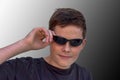 Teenage boy with modern sunglasses Royalty Free Stock Photo