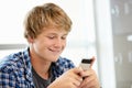 Teenage boy with phone in class Royalty Free Stock Photo