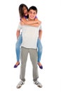 Teenage boy piggybacking teenage girl