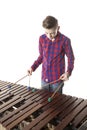 Teenage boy playing marimba in studio