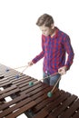 Teenage boy playing marimba in studio