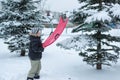 Teenage boy playing snow in winter Royalty Free Stock Photo