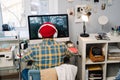 Teenage boy playing video game on desktop computer at home Royalty Free Stock Photo