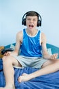 Teenage boy playing a video game Royalty Free Stock Photo
