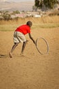 Teenage Boy Playing with Wheel - Rear View Royalty Free Stock Photo