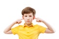 Teenage boy plugs ears Royalty Free Stock Photo