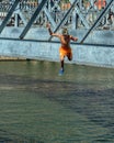 Teenage boy plunging into the River Douro, Porto, Portugal. Royalty Free Stock Photo