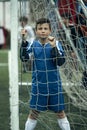 Teenage boy portrait near the gate on the football field. Royalty Free Stock Photo