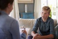 Teenage Boy With Problem Talking With Counselor At Home Royalty Free Stock Photo