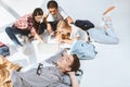 teenage boy resting while multiethnic friends using laptop together Royalty Free Stock Photo