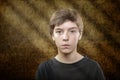 Teenage boy with scary brown background