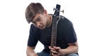 Teenage boy showing neck bass guitar Royalty Free Stock Photo