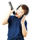 Teenage boy singing into a microphone and gesticulates with a hand. Very emotional. Royalty Free Stock Photo