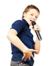 Teenage boy singing into a microphone and gesticulates with a hand. Very emotional. Royalty Free Stock Photo