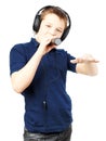 Teenage boy singing into a microphone and gesticulates with a hand. Very emotional Royalty Free Stock Photo