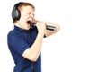 Teenage boy singing into a microphone. Very emotional. Royalty Free Stock Photo