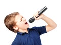 Teenage boy singing into a microphone. Very emotional. Royalty Free Stock Photo