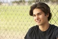 Teenage Boy Sitting In Playground Royalty Free Stock Photo