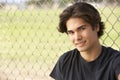 Teenage Boy Sitting In Playground Royalty Free Stock Photo