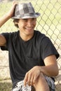 Teenage Boy Sitting In Playground Royalty Free Stock Photo