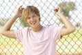 Teenage Boy Sitting In Playground Royalty Free Stock Photo