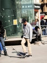 Teenage boy with skateboard on the street