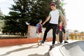 Teenage boy skateboarding outdoors Royalty Free Stock Photo