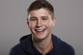 Teenage boy smiling to camera, head and shoulders portrait Royalty Free Stock Photo