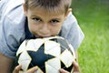 Teenage boy with a soccer ball in his hands against the background of the stadium. Royalty Free Stock Photo