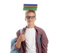 Teenage boy with stack of books on his head against white background Royalty Free Stock Photo