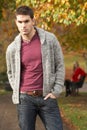 Teenage Boy Standing In Autumn Park