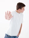 Teenage boy standing with hand up Royalty Free Stock Photo