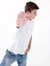 Teenage boy standing with hand up Royalty Free Stock Photo