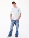 Teenage boy standing with hands in pockets Royalty Free Stock Photo