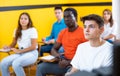 Teenage boy studying in taxi driving school