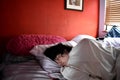 Teenage Boy Taking a Nap in Bedroom