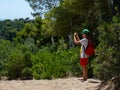 Teenage boy taking pictures with mobile phone