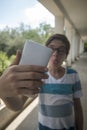 Teenage boy taking a selfie Royalty Free Stock Photo