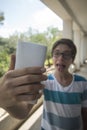 Teenage boy taking a selfie Royalty Free Stock Photo