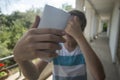 Teenage boy taking a selfie with his phone Royalty Free Stock Photo