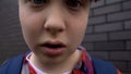 Teenage boy teasing, bullying into camera, provocation to fight, victim POV