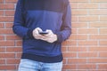 Teenage boy texting message in outside Royalty Free Stock Photo