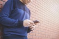 Teenage boy texting message in outside Royalty Free Stock Photo