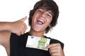 Teenage boy with a ticket of 100 euros Royalty Free Stock Photo