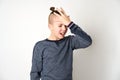 Teenage boy tired having headache, white background