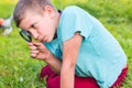 Boy with a magnifying glass Royalty Free Stock Photo